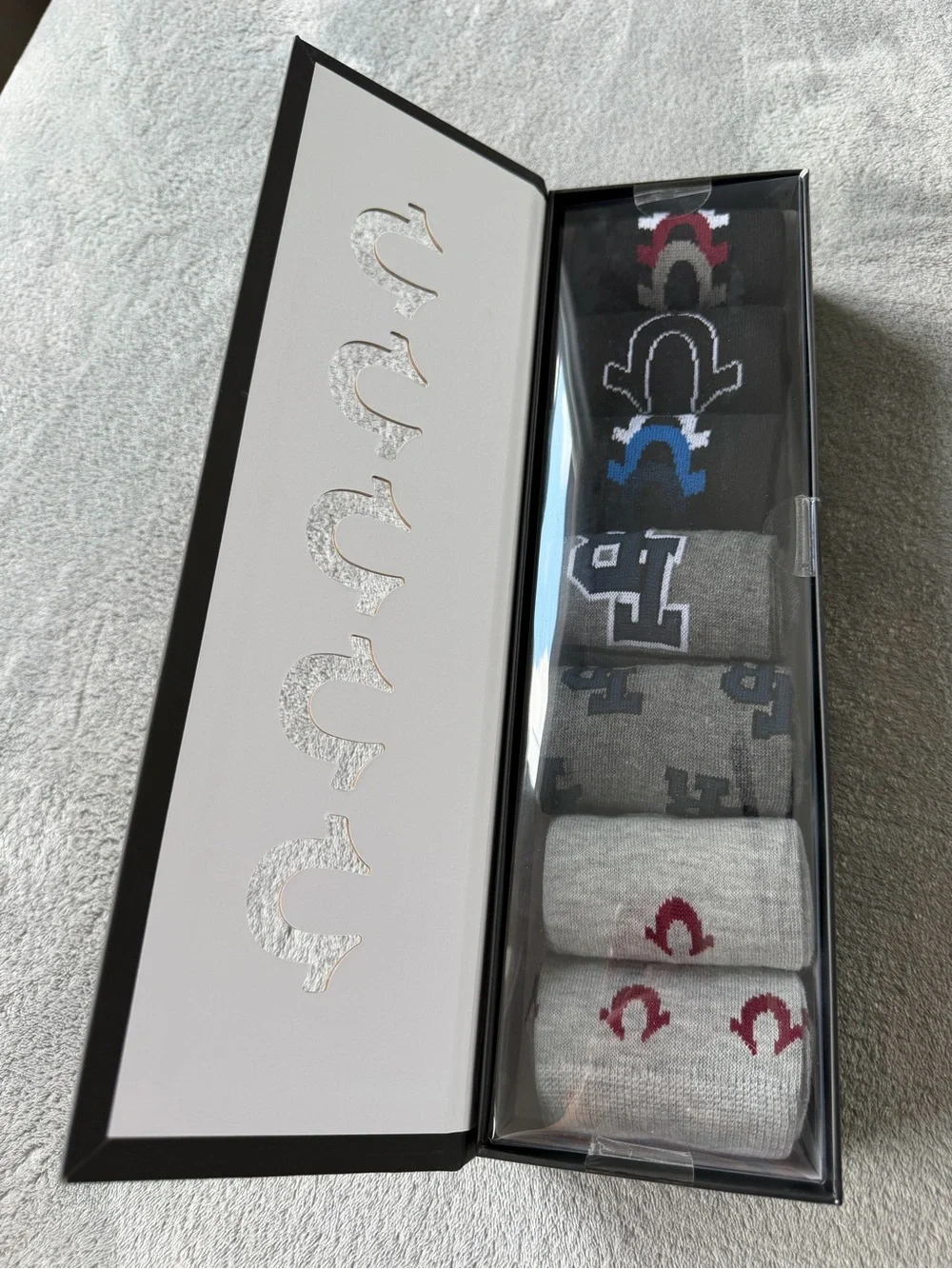 True Religion Black Gift Box with Red Logo and Silver Horseshoe Cutouts